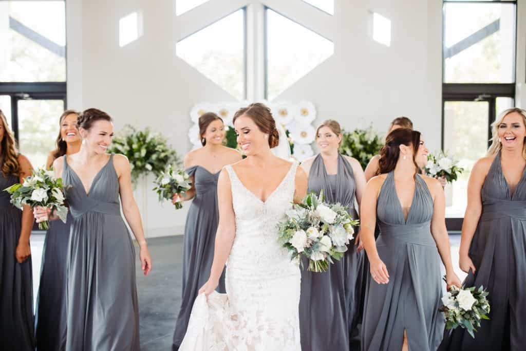 bride and bridesmaids in gray dresses