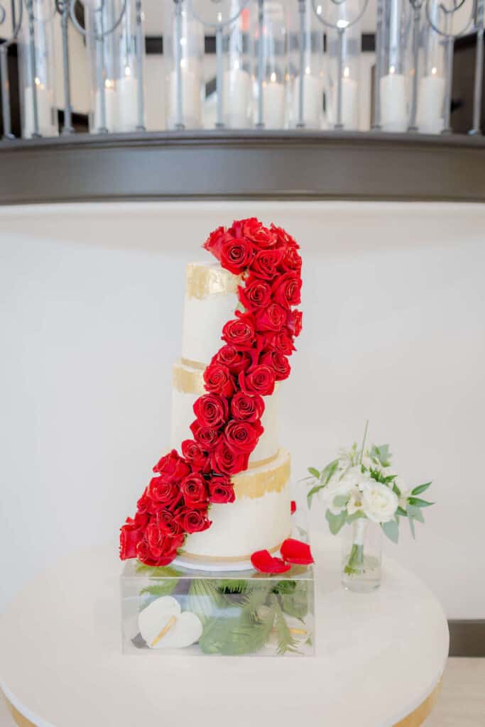 modern cake with red roses cascading