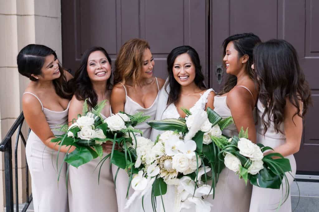 bride with bridesmaids in satin dresses