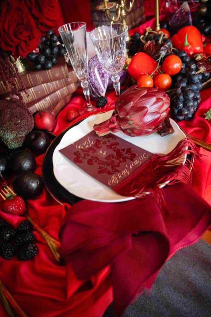 Red tablescape and menu designed by Épris Events