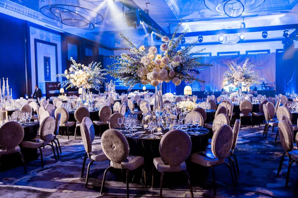 Black-tie gala with tall floral centerpieces designed by Épris Events