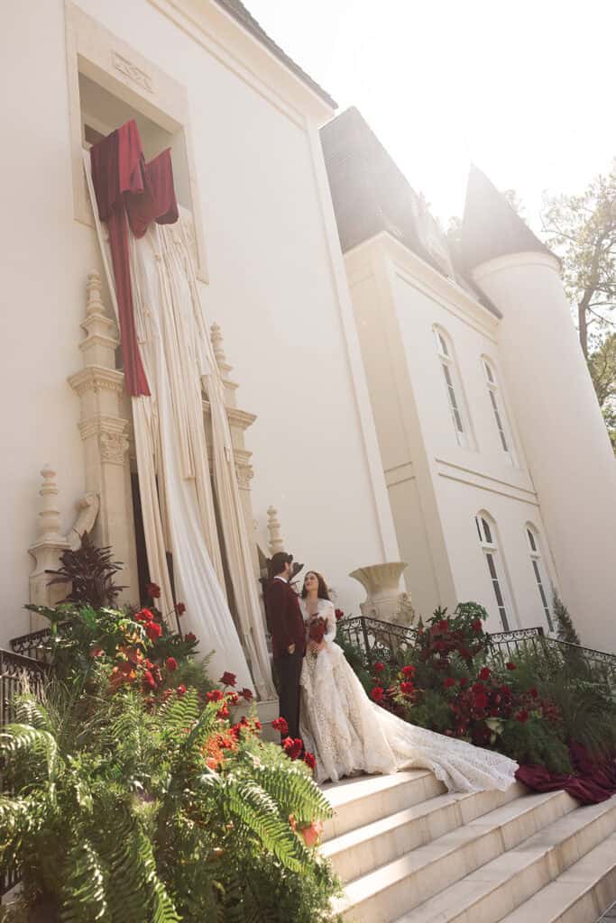 Burgundy and ivory French chateau wedding editorial at Chateau Nouvelle, designed by Épris Events – photo by Emily Snyder Photography